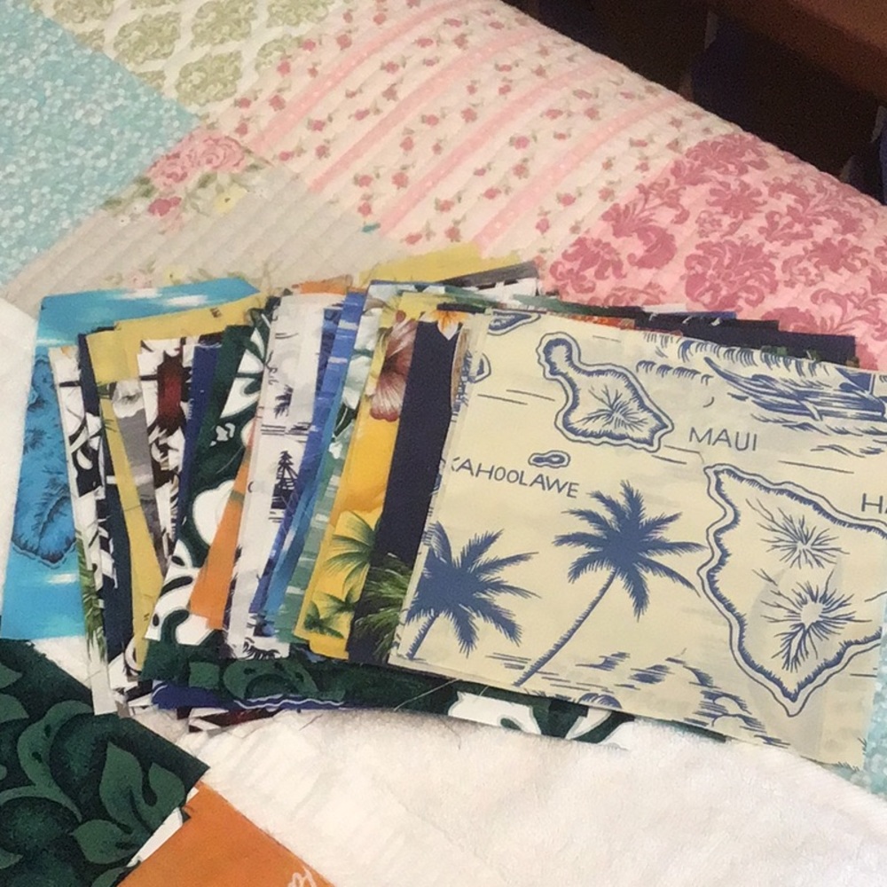 Assorted Hawaiian fabric squares7x7” pic included quanty varies 68 total squares